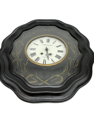 Eye catcher wall clock in black lacquered wood. SCHNELLBACH in ELBEUF. White enameled dial with Roman numerals.