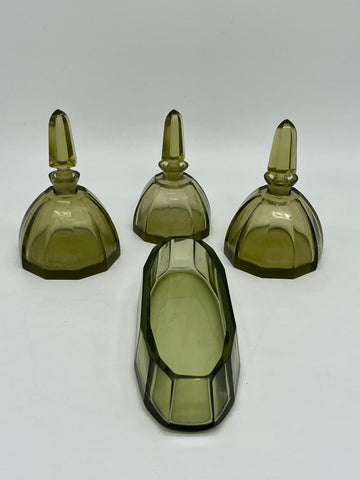 Four bathroom bottles for perfume