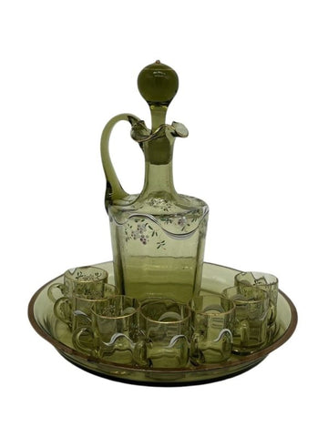 Liqueur service in green glass with enamelled decoration of flowers