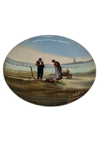 Pair of elegant glazed earthenware dishes reproducing the Angelus and the Glaneuses, signed below
