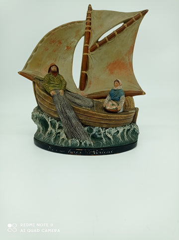 Large boat with two terracotta figures named "lifting the net"