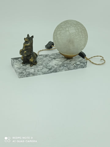 Marble table lamp with a dog sculpture
