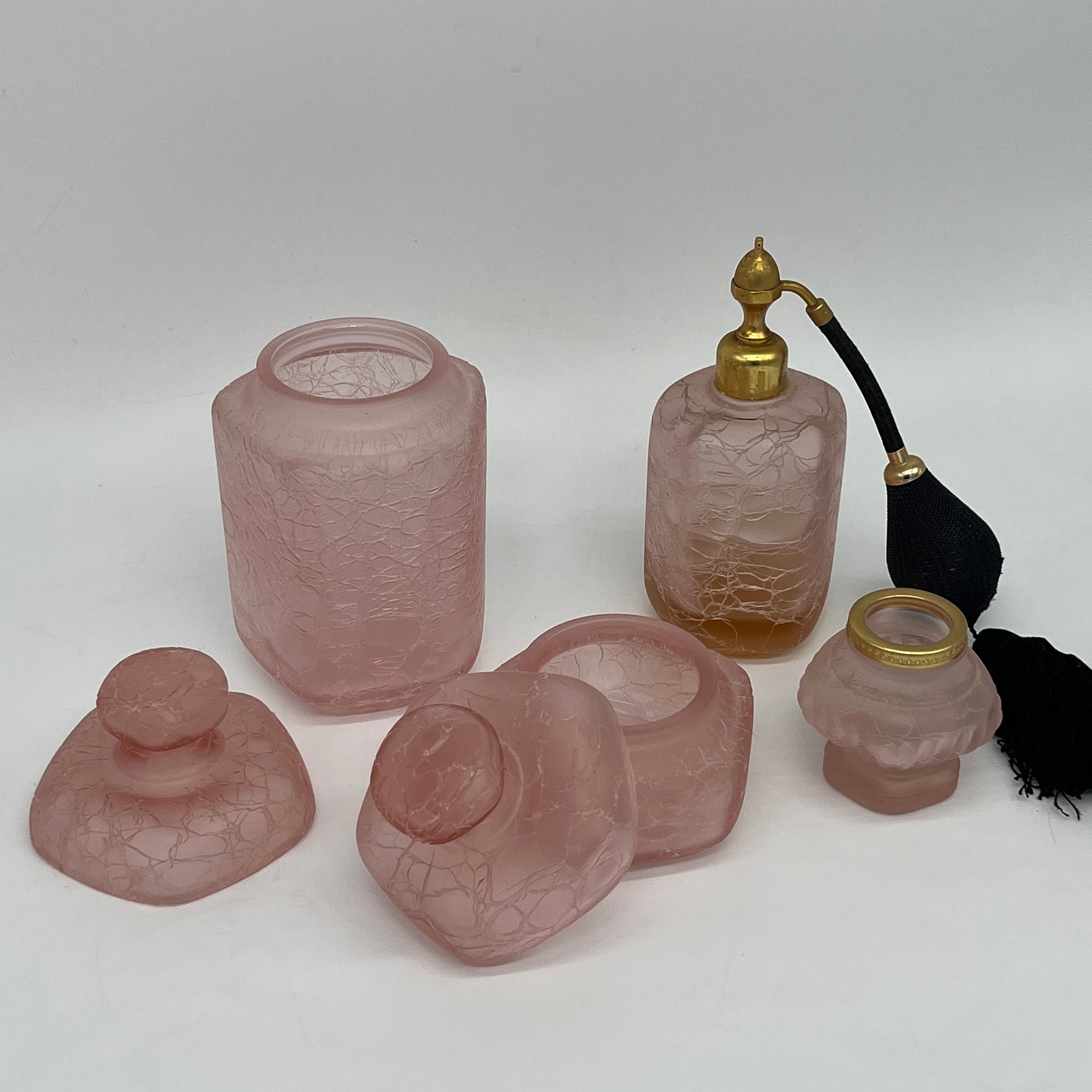 Four pink and original bathroom bottles