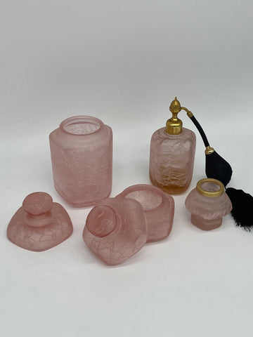 Four pink and original bathroom bottles