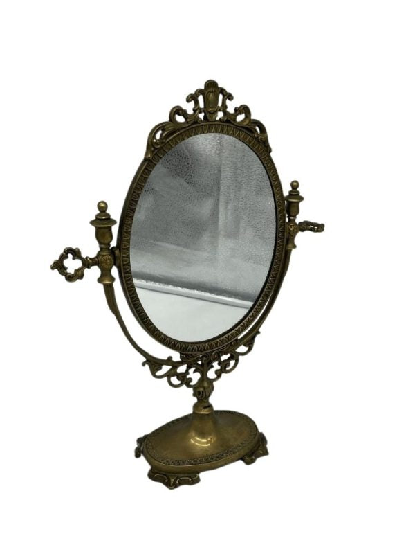 Original Tilting oval-shaped bronze table mirror. Rococo style