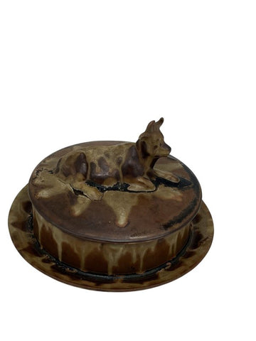 Covered butter dish in enameled stoneware decorated with bovids, model numbered 39 in the house catalog